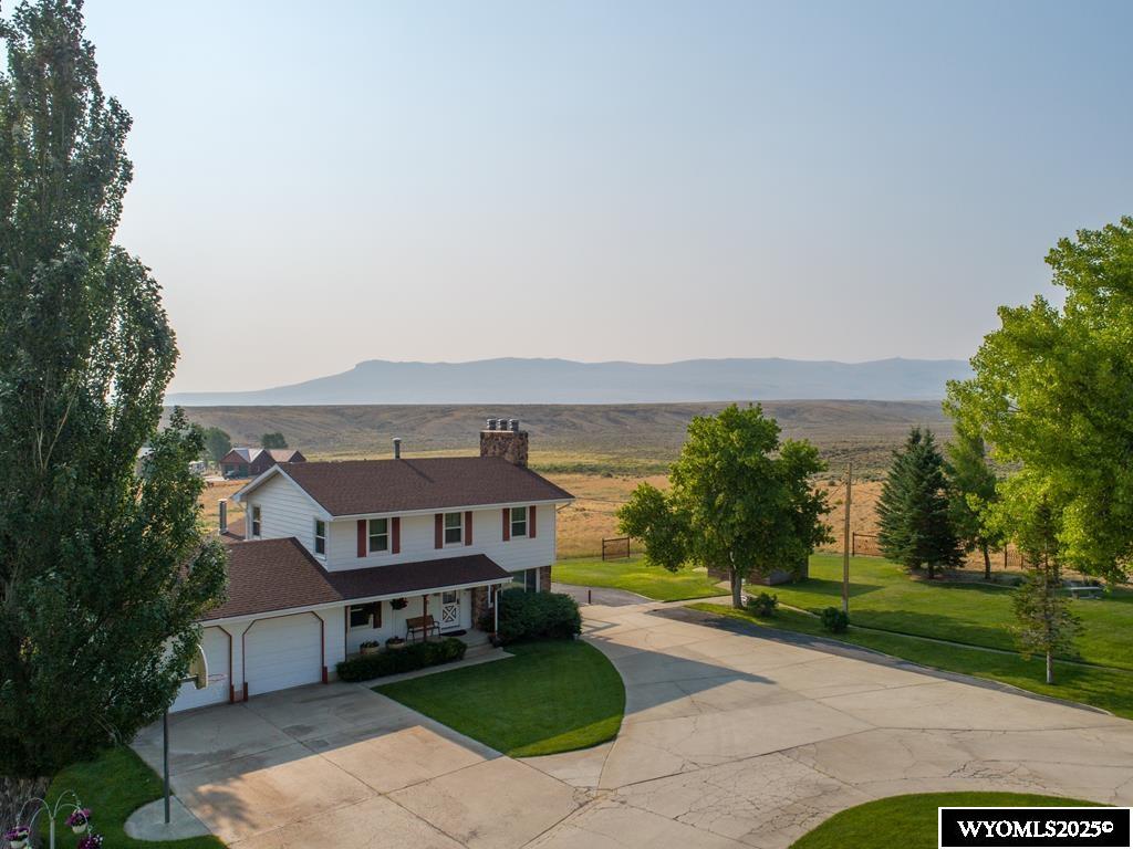 The Kolman Ranch includes the following Amenities with the Sale of the Property:   • 12.85 Deeded Acres with 7 adjudicated water wells.  • The main water well produces 110 gallons per minute with a 5 HP pumping 90 GPM on demand.   • All mineral rights are included in the price.  Detailed Descriptions of the Four Homes Located on the Property19A is the primary residence that is a 3,568 SF two-story steel-sided house with 5 bedrooms, 3 1/2 bathrooms, 4 wood burning fireplaces and a fully finished basement.   19A Details • (4) smart home thermostats  • (4) security cameras  • Schlage keypad locking front door with announcing/intercom door  • Newly installed natural gas heating high efficiency boiler • New luxury steam shower  • High efficiency triple pane windows • 40 gallon hot water heater • Fireplaces in the master bedroom, living room, family room and basement • Large closets and storage areas • Custom-built Oak Kitchen Cabinets • New double oven, microwave and glass cook top • Double door fridge and stainless steel dishwasher • Large reverse osmosis water treatment system   • Custom ducted swamp cooler for upstairs and main floor cooling.  • Large deck with 240 volt wiring for a hot tub • Two car heated garage with large pantry and storage with extra fridge and freezers.  New overhead insulated doors with windows • Custom-built office cabinetry   19B 19B is 696 SF with 2 bedrooms, 1 bathroom, living room, kitchen, and sunroom. This 1970 Marlette home is on a permanent foundation. Forced air furnace with a wood burner stove. All appliances with washer and dryer  included.   Currently rented for $950.00 per month.  19C 19C is 1,000 SF framed home with 1 bedroom, 1 bathroom, large living room, kitchen, and attached heated car garage. 19C is a renovated Union Pacific that is well insulated home on a permanent concrete foundation. Heated with natural gas wall furnaces. All appliances with washer and dryer included.   Currently rented for $900.00 per month.  19D 19D is 1,280 SF with 3 bedrooms, 2 bathrooms, living room and kitchen. This 1985 Westpark home is well insulated and heated by natural gas forced air and highly efficient wood burning stove with a swamp cooler for summer use. All appliances with washer and dryer included.  Currently rented for $1,250.00 per month Detailed Descriptions of Additional Buildings and Amenities Located on the Property  Brick Pump House with original water well. 110 GPM water well is piped in from the southwest corner of the property. Grunfos CU3315P 5 HP Submersible Pump capable of 90 GPM.  Onan/Kohler Auxiliary Electric Generator supplies power for water pump and 19A & 19B when Rocky Mountain Power fails. Natural Gas supplied.  North Star Ultra Water Softener supplies all the buildings with soft water. 2 Culligan water filters. (Also, one in 19A home)  Sprinkler System consists of 16 Zone Rain Bird controller with 14 zones in use.  The Main Water Well location is lighted in a 12 foot deep galvanized inverted culvert with insulated deck flooring and capped with a large fiberglass cover.  Brick Slaughter/Butcher Shop which has its own water well and piped in water from the main system. Natural gas availability for heating and water tank. Steel rail track and pulley to hoist animal carcasses for cleaning and butchering.  Small steel sided Children’s Play House with swings, monkey bars, and slide.  Metal Storage Shed currently designated for flammable materials (oil and gas).  Brick Machine Shop with storage cabinetry and shelving.  Parking for three vehicles.  Heated with a natural gas overhead furnace. Water faucet and drain sump in place. 240 volt power for welding. Fluorescent overhead lights. Electric garage door.  Second Metal Storage Shed is available for use for additional storage.  Northwest Brick Storage Building is primarily used for renter’s storage. Water is also available in a faucet.  Large Brick Cattle and Hay Barn is pri