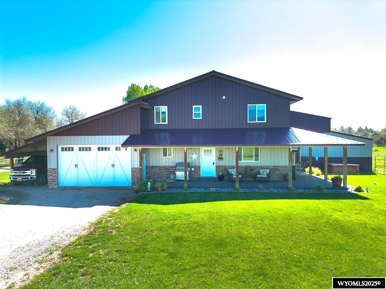 This is the Horse property you have been dreaming of!  Featuring a custom built home, 176X104 indoor riding arena with a 20X32 attached garage/shop, heated bathroom, tac room, 4 exterior stalls, 4 interior stalls in the arena offering ample storage for dry hay storage.  With irrigation, abundant mountain views, approximately 6.71 acres, and convenient location just at the edge of the city limits, this property is ideal for the horse lovers. The house is a 2-story home built in 2014 with 3 bedrooms including a true master bedroom and an attached 2 car garage and a carport. Inside you will find a tastefully finished living area with a custom kitchen featuring granite countertops and stainless- steel appliances.  The upstairs offers 2 large bedrooms, an office area, and a generous family room. A property with this amount of seclusion, creek frontage with City water and close proximity to town makes it a rare find! Schedule your private showing today. Call Ann Espinosa 307-349-2752