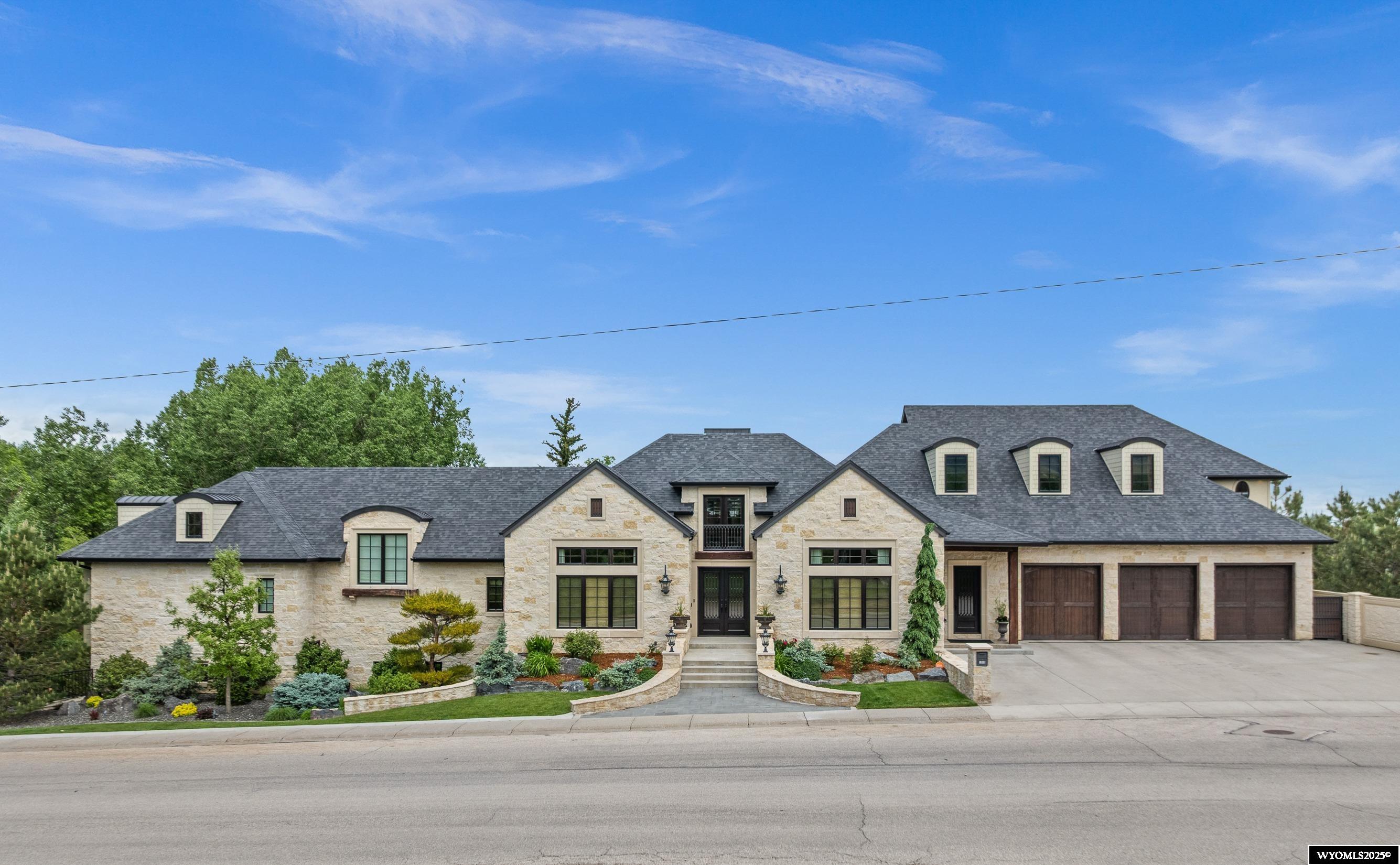 Step into this breathtaking home that seamlessly blends the comfort of a residence with the relaxation of a resort. This stunning custom-built home is perfectly positioned to capture beautiful mountain views as well as views of Garden Creek which flows through the beautifully landscaped backyard. Every level of this exceptional home is meticulously designed for your ultimate comfort and convenience. The main level master suite has his & her custom baths, a spacious closet, laundry, & a uniquely designed shower that is sure to impress. The kitchen is built for effortless entertaining with beautiful custom cabinets, paneled appliances and pot filler. The living room showcases beautifully vaulted ceilings and a cozy gas fireplace. The upper living quarters includes its own laundry, kitchenette & 2 bedrooms with amazing custom-built bunk beds. The expansive basement has two master bedroom suites with private bathrooms, heated floors, laundry area, lots of storage space, a bar area, safe room & clever hidden storage for utilities as well as a walk out to the patio. The heated garage has room for all the activities as well as tall ceilings to accommodate a car lift. Additional custom details include an Ipe deck on steel beams, timer-controlled lighting in the trees/landscaping and real stone. This home is truly one of a kind, with no detail overlooked. Don’t miss the opportunity to make it yours! Call Kevin Bromley 307-259-8087 or Ryan Bromley 307-258-3766