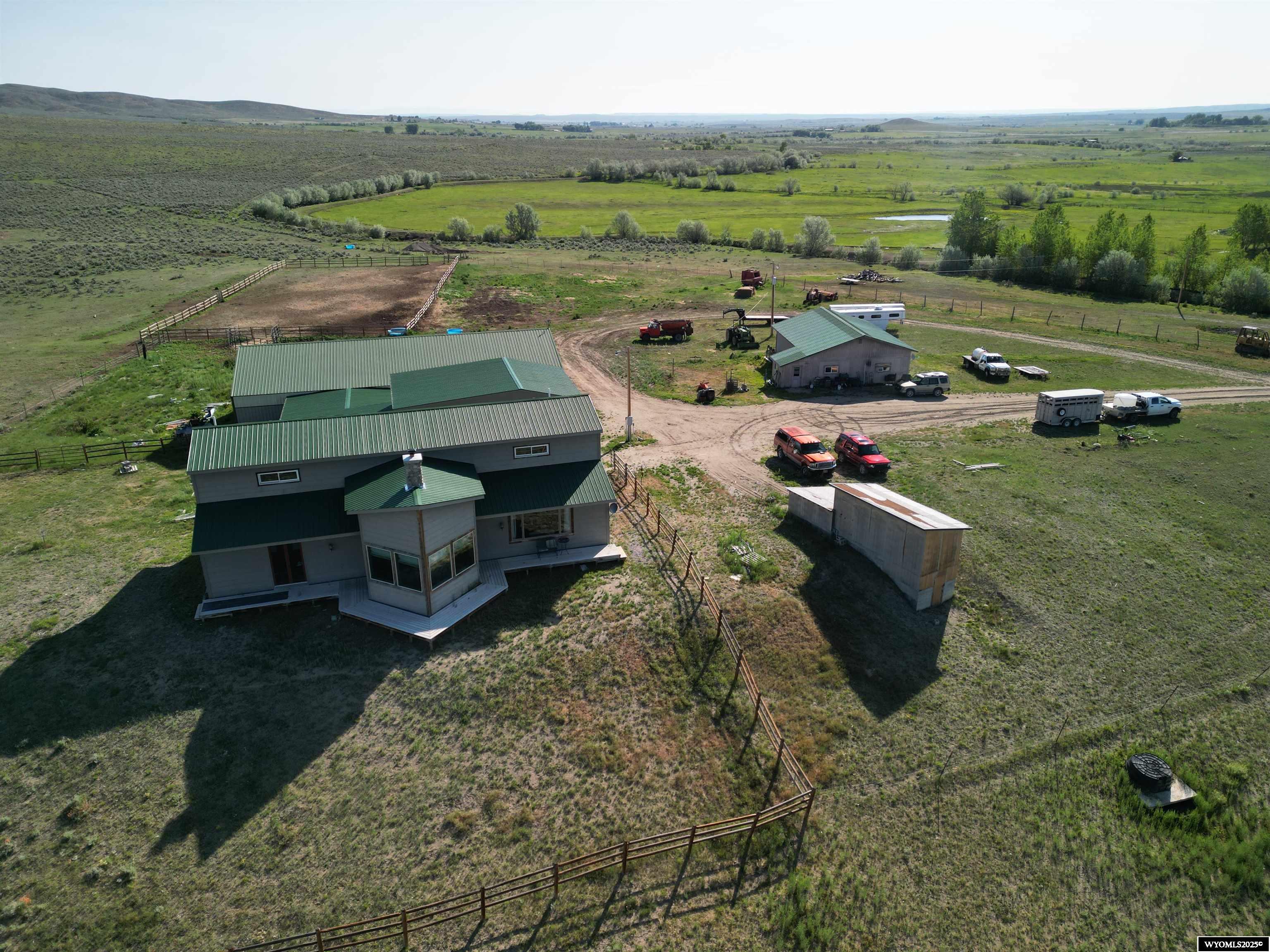 230-Acre Premier Horse Ranch — Wind River Mountain & Ray Lake Views Overview & Location Set against the dramatic backdrop of the Wind River Mountains—part of Wyoming’s majestic Rocky Mountains—this 230-acre equestrian paradise offers irrigated meadows and breathtaking vistas of Ray Lake and Little Ray Lake. Just 7.5 miles from Lander, Wyoming. Insurable access is included at highway 287 and  there is a secondary picturesque, tree-lined drive that provides access for this expansive and private estate.  Irrigation supports lush pastures—ideal for grazing, hay production, or irrigated crops.  Rolling terrain with open fields and tree-lined shelterbelts provides both functionality and scenic variety.  Main Residence is 3,008 square feet.  Luxurious finishes: rich Rosewood/Cherry/Granite countertops in the kitchen and dining areas.  Tavern-grade oak floors flow beneath soaring 10-ft ceilings; great room features vaulted ceilings—an ideal space for gatherings with panoramic mountain views.  Three ensuite bedrooms, each with walk-in closets; built for comfort and privacy.  Outbuildings & Equestrian Amenities  Insulated, 1.5-car garage includes a loft and heated work room—versatile for storage, hobby space, or ranch repairs.  Attached tack room, bathroom, and heated insulated stall make care and convenience effortless.  Spacious barn with multiple stalls plus an outdoor round pen.  Outdoor riding arena 100'×200'—perfect for training, lessons, or hosting clinics.  A separate 1,200sq/ft residence—ideal for guests, staff quarters, or potential rental income—provides flexibility and full on-site living options.  Scenic & Recreational Highlights  Unmatched panoramic views of the Wind River Range and shimmering lakes—ideal for sunrise and sunset moments.  Excellent layout for trail development—ride directly from the arena through irrigated fields, around the ponds on the property, or tour the 200+ year old homestead which still exists on the acreage.  Opportunistic wildlife viewing and seasonal hunts in the surrounding corridor; big game and waterfowl frequent the irrigated pastures and riparian zones.  Lifestyle & Potential A rare turnkey estate designed for serious equestrian/ag pursuits, entertaining, and multigenerational living. Whether you're training horses, hosting retreats, or enjoying the western ranch life, this property is uniquely positioned to fulfill those ambitions. Contact Brian Wise at 307-851-4557 for your showing!