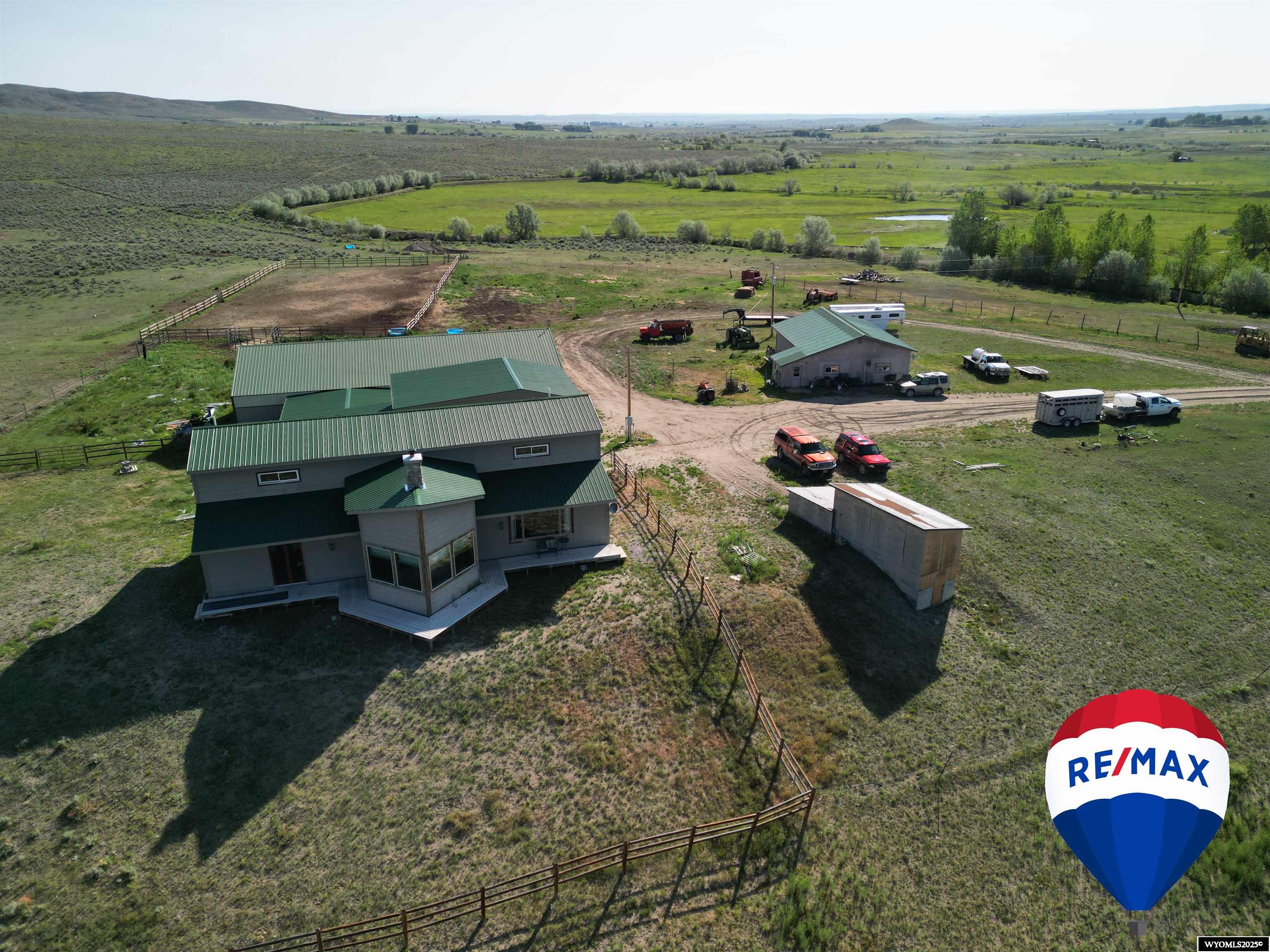 230-Acre Premier Horse Ranch — Wind River Mountain & Ray Lake Views Overview & Location Set against the dramatic backdrop of the Wind River Mountains—part of Wyoming’s majestic Rocky Mountains—this 230-acre equestrian paradise offers irrigated meadows and breathtaking vistas of Ray Lake and Little Ray Lake. Just 7.5 miles from Lander, Wyoming. Insurable access is included at highway 287 and  there is a secondary picturesque, tree-lined drive that provides access for this expansive and private estate.  Irrigation supports lush pastures—ideal for grazing, hay production, or irrigated crops.  Rolling terrain with open fields and tree-lined shelterbelts provides both functionality and scenic variety.  Main Residence is 3,008 square feet.  Luxurious finishes: rich Rosewood/Cherry/Granite countertops in the kitchen and dining areas.  Tavern-grade oak floors flow beneath soaring 10-ft ceilings; great room features vaulted ceilings—an ideal space for gatherings with panoramic mountain views.  Three ensuite bedrooms, each with walk-in closets; built for comfort and privacy.  Outbuildings & Equestrian Amenities  Insulated, 1.5-car garage includes a loft and heated work room—versatile for storage, hobby space, or ranch repairs.  Attached tack room, bathroom, and heated insulated stall make care and convenience effortless.  Spacious barn with multiple stalls plus an outdoor round pen.  Outdoor riding arena 100'×200'—perfect for training, lessons, or hosting clinics.  A separate 1,200sq/ft residence—ideal for guests, staff quarters, or potential rental income—provides flexibility and full on-site living options.  Scenic & Recreational Highlights  Unmatched panoramic views of the Wind River Range and shimmering lakes—ideal for sunrise and sunset moments.  Excellent layout for trail development—ride directly from the arena through irrigated fields, around the ponds on the property, or tour the 200+ year old homestead which still exists on the acreage.  Opportunistic wildlife viewing and seasonal hunts in the surrounding corridor; big game and waterfowl frequent the irrigated pastures and riparian zones.  Lifestyle & Potential A rare turnkey estate designed for serious equestrian/ag pursuits, entertaining, and multigenerational living. Whether you're training horses, hosting retreats, or enjoying the western ranch life, this property is uniquely positioned to fulfill those ambitions. Contact Brian Wise at 307-851-4557 for your showing!