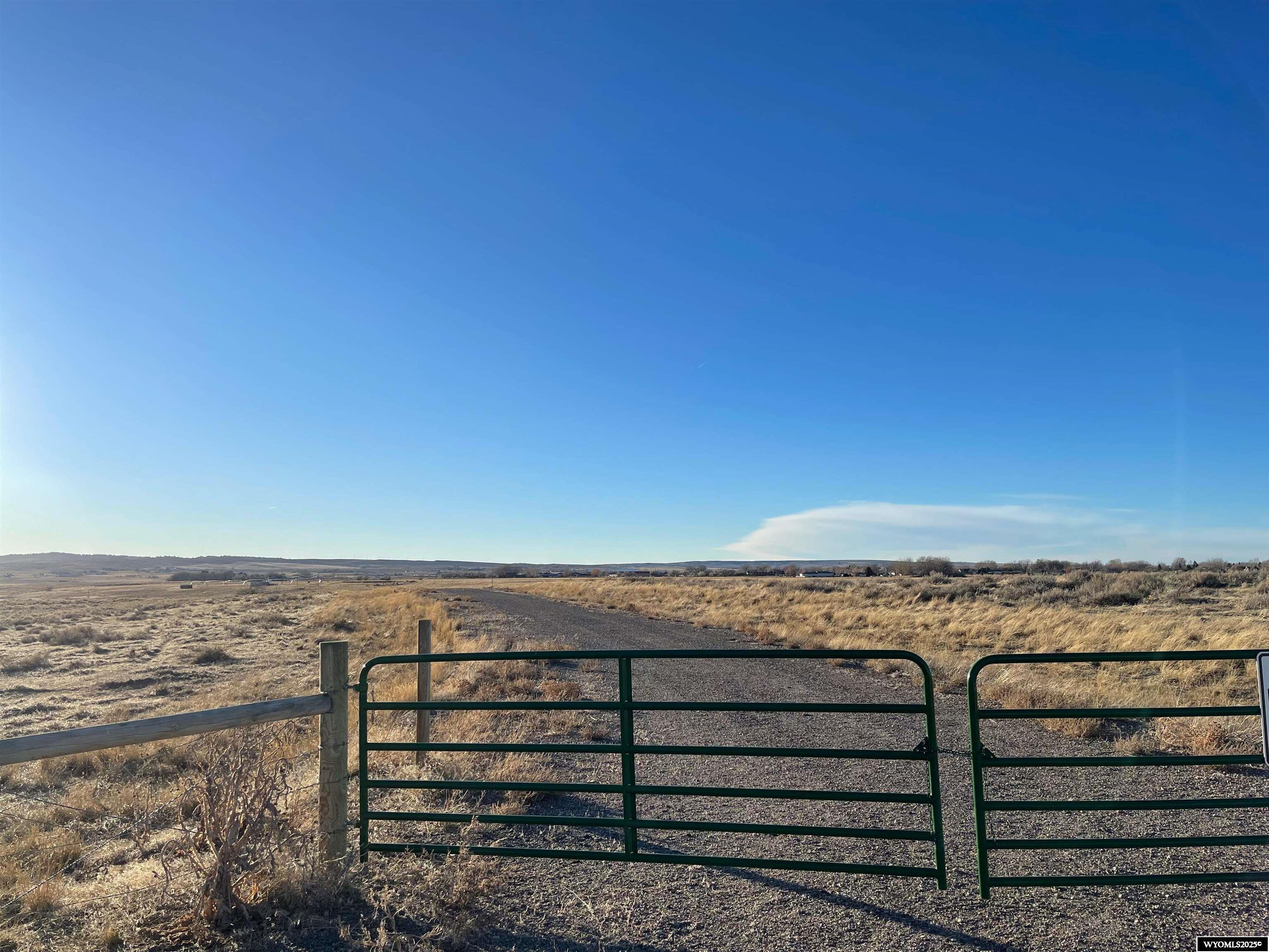 Located off Robertson Road this rare large acre property features approximately 122 acres of county land close to public services. The parcel features 60 irrigated acres and offers endless opportunities. With room for horses, riding areas, barns, shops and more you can make this private oasis suit your needs. Utilities are near by and offer ideal access to the bypass, west Casper retail and I-25 while offering unique privacy and tranquility.