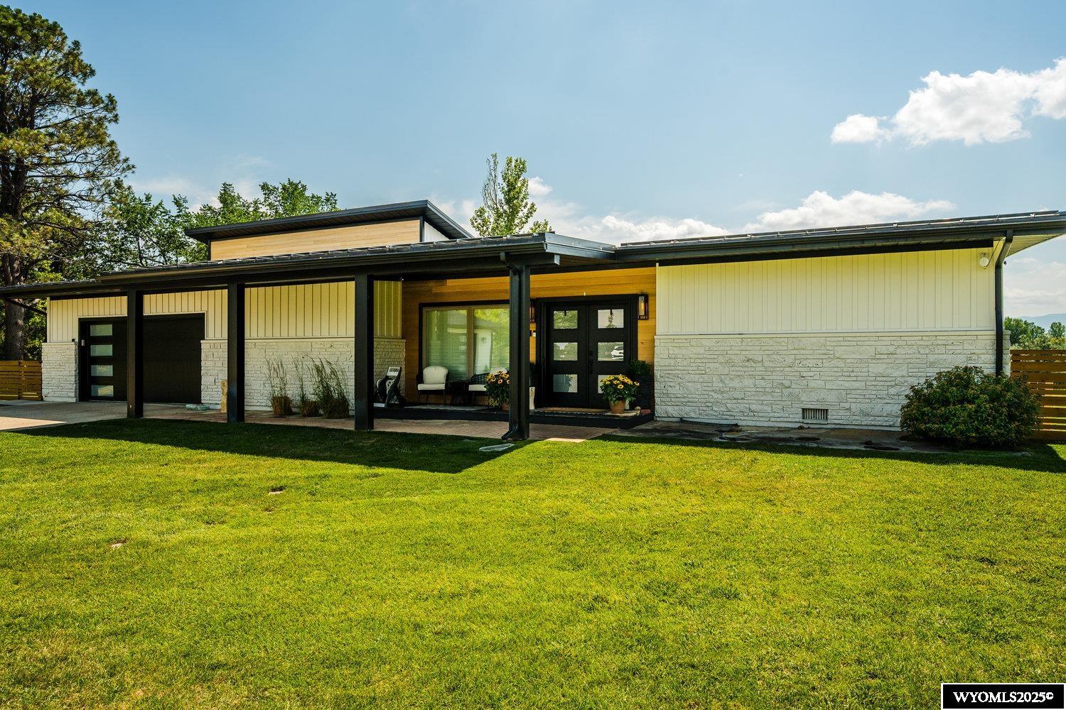 Country living in town. Just minutes away from downtown Sheridan. This may be one of the Sheridan area best kept secrets. Stunning remodeled contemporary home with mountain views.and has had only 2 owners. You won't believe what this house and property have to offer. Discover unparalleled luxury and breathtaking beauty in this fully remodeled 4-bedroom, 4-bathroom masterpiece, remodeled by Inyarak Construction in 2020. This exquisite home offers modern elegance and panoramic views of the Bighorn Mountains, making it the perfect retreat for those seeking style, comfort, and nature's splendor. Relax at the newly constructed fire pit arena and enjoy the evening mountain views. Who are you kidding... can this be for real?  Step into a bright, open-concept living space with all new flooring, expansive windows that let the outside in, and clean lines. The state-of-the-art kitchen is a culinary haven, featuring high-end stainless-steel appliances, quartz countertops, a large center island, and custom cabinetry. The space is ideal for hosting gatherings or intimate dinners with stunning Big Horn mountains as your backdrop. The primary suite is a sanctuary of sophistication, boasting a spacious walk-in closet and a spa-like ensuite with dual vanities, and a glass shower. Three additional bedrooms provide ample space for family, guests, or a home office, ensuring privacy and comfort for all. Outside, the meticulously landscaped backyard, which has just been completed, and offers a serene escape with a spacious patio, perfect for morning coffee, dining, or gathering with family and friends. The property's prime location in Sheridan combines small-town charm with modern conveniences, just minutes from vibrant downtown shops, dining, top-rated schools, and outdoor adventure. The property is unique in that it feels like country living, in-town. City water, paved street, driveway, and other city services, and nestled in a quiet location. With numerous upgrades, theater room, and a two-car garage and a shop that currently hosts a golf simulator. This move-in-ready home blends low-maintenance living with high-end finishes. Don't miss your chance to own this architectural gem in one of Wyoming's most picturesque settings. Schedule a private showing today to experience the perfect fusion of contemporary luxury and Wyoming's natural beauty!