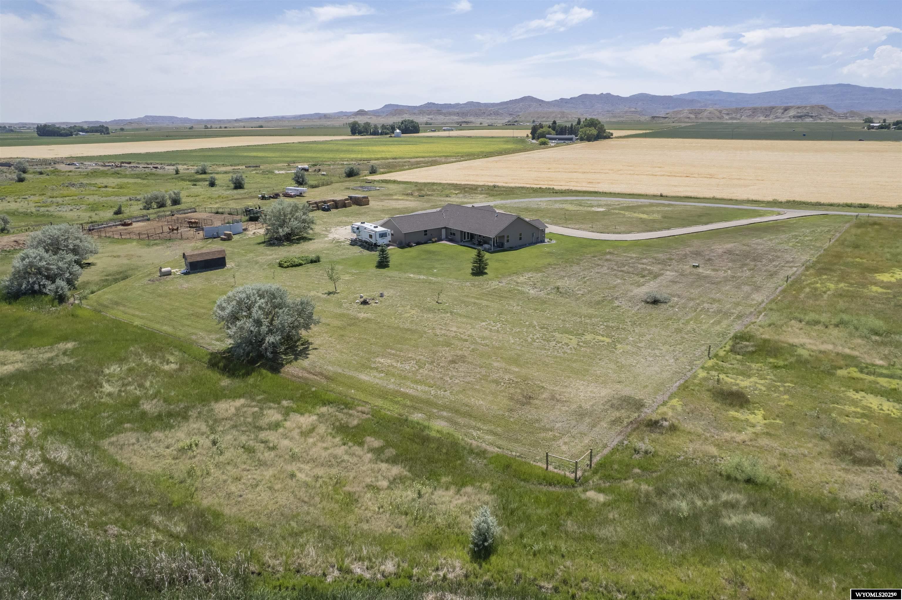 Beautiful Custom Home with 75 Acres & Shoshone River Frontage  Located at 1291 Lane 13, Powell, WY, this breathtaking 3-bedroom, 2-bath home sits on 75 acres, including 38.44 irrigated acres serviced by the Willwood Irrigation District. This property offers the perfect balance of luxury, rural living, and proximity to outdoor adventures. Key Features: - With 2319 sq ft of thoughtfully designed living space, this home is ideal for those who appreciate the finer details and open-concept design. Expansive windows provide unparalleled views of the surrounding countryside and the Shoshone River bottom that flows through the property.  - The riverfront setting creates a peaceful atmosphere, offering plenty of opportunities for fishing, wildlife watching, and recreation. Plus, you’re just a short drive from Yellowstone National Park and Bighorn Canyon Recreation Area, where outdoor enthusiasts can explore trails, lakes, and rugged terrain. - This 2017 custom-built home features exceptional craftsmanship with a natural gas fireplace in the living room for cozy winter nights, and a 2-car oversized heated garage for year-round convenience. Powell is known for its friendly community, rich agricultural history, and scenic surroundings. Situated along the Shoshone River and surrounded by McCullough Peaks to the south and the Bighorn Mountains to the north, Powell offers a blend of small-town charm and easy access to outdoor adventures. Co-listed with Jacque Zurcher from Mason & Morse Ranch Co 307-631-2855