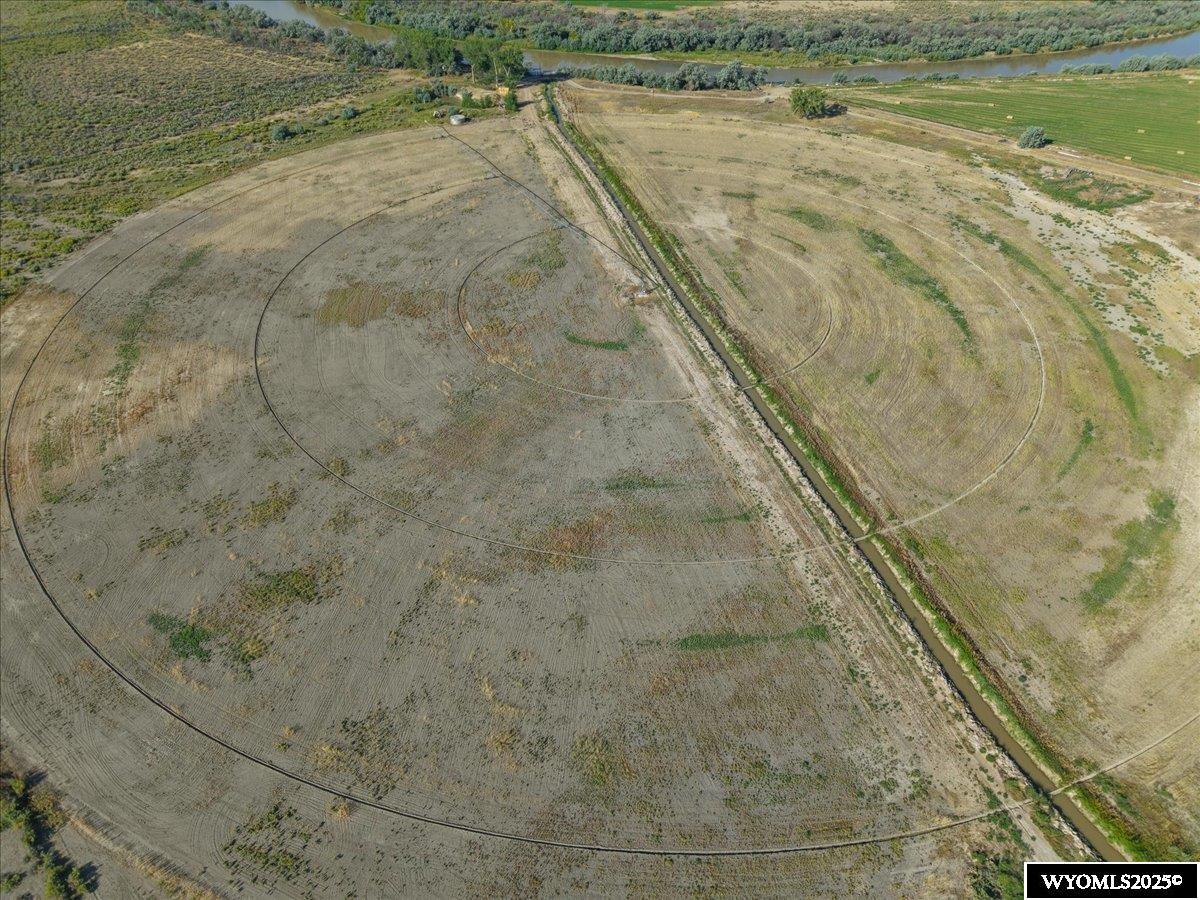 40 Acres of Agricultural Farm Ground on the Big Horn River – Big Horn County, WY Located in the productive region of Big Horn County, Wyoming, this 40-acre parcel offers a prime opportunity for agricultural expansion or investment. With 30 irrigated acres under a 2017-3 Tower Zimmatic center pivot irrigation system, the property is designed for efficient and reliable water delivery. A settling pond enhances water quality and supports the system, drawing from the Tillard canal that adds to the parcel’s irrigation strength. Access is convenient and dependable thanks to an easement from a county-maintained road, ensuring year-round access without compromising the solitude and vast acreage that ag operators value. The land is level and tillable, set in a dry-basin climate well-suited for hay production, small grains, or grazing. Situated in a region known for its strong agricultural roots and proven yields, this property offers the infrastructure and location to support long-term productivity. Whether you're expanding your current operation or securing irrigated ground in a respected ag community, this parcel is ready to perform.