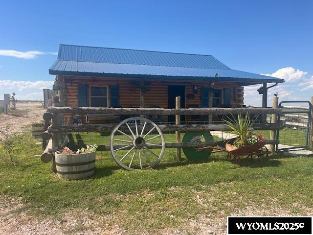 An outstanding quarter section capable of growing any valley crops and also pasturing a small herd of cattle year-round.   The log cabin is modern with total electric service.  Central air conditioning was added in 2025. There is a windmill with a standby water hydrant. There are four pastures for grazing rotation fenced with 5 wire and wooden posts. A 50 x 50 metal machine shed, a three-stall horse barn and detached storage shed, that could easily be converted to a guest house.   A lockable tack shed adjoins the horse barn.  The home sits atop a hill and provides excellent views of the valley.  This is a very well-kept property and deserves a look.