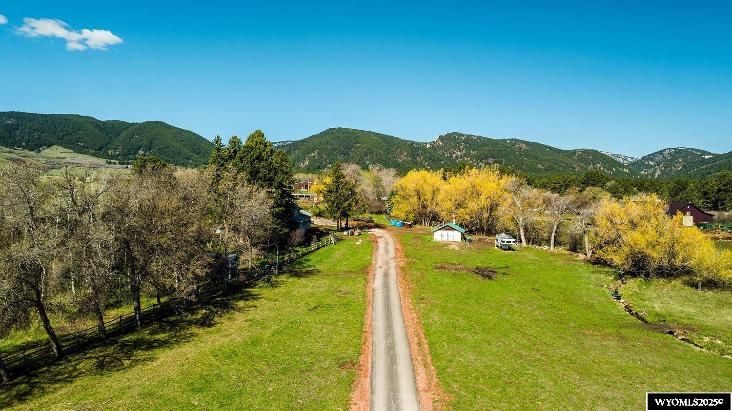 Once in a lifetime opportunity awaits you on this beautiful 17.36 acre property with artesian springs and majestic views up Little Piney Canyon and expanding across the foothills of the Big Horn Mountains. The 3226 SF home was completely remodeled in 2025. Perfect for family with the 4 bedrooms (one upstairs bedroom can easily be a large bonus room), and 3 baths. The kitchen is a chefs dream with copper sink and stove vent and pot filler facet, 2 large ovens and an 8 burner stove! There is also a 5500 SF metal shop for equipment, hay and extra storage for toys and etc. A barn with tack room and stalls. Also has lean to sheds for stock to get out of the weather. Located close to the town of Story and all the amenities known to Story. Easy access to Penrose Trail and South Piney trailhead for horse, 4 wheeler and foot travel into the National Forest and into the Cloud Peak Wilderness.