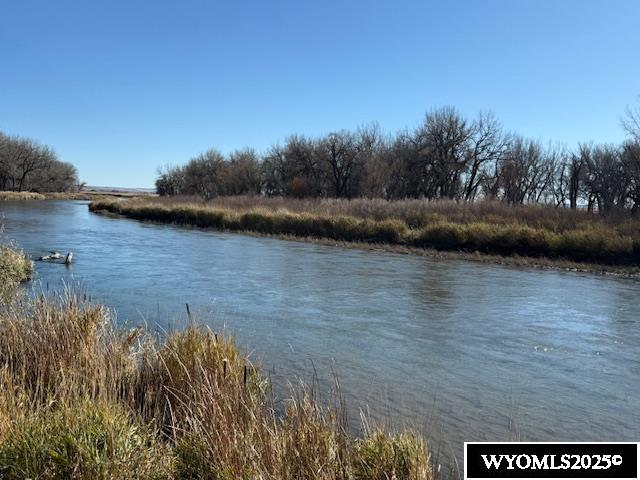 This is a one of a kind property located just West of Morrill, NE with excellent year round access.  A hunters "Paradise" with over a mile of Platte River water frontage located on the main channel.  This gorgeous scenic area has an abundance of water fowl. There is room to put in a hunting lodge or cabins to inspire hunters from all over to come and hunt. A warm water slough/wetlands is inviting to the ducks and geese in the area. The 300+/- acres of trees and native grass provides ample protection for the deer and water fowl. In addition to the hunters "Mecca" there is 215.92 +/- irrigated farm with an abundance of water. 153.86 +/- ac are under pivot with the remainder irrigation pipe. The farm has a one year old, 10 tower, pivot system. Three registered electric powered irrigation wells: 1. 800 GPM; 80 Acres 2. 1200 GMP, 54 Ft depth, 109.10 Acres. 3. 500 GPM, 14.30 Acres. All electric lines are underground. One of the Water Rights is with Pathfinder Irrigation District; $1152.00 a year. Additional water right is a grandfathered "Preferred farmers" water right, no charge. The 215.92 +/- ac of farm ground is one of the most productive farms in the valley. The native grass will pasture about 50 pairs for a period of about 6 month. The grass has never been over grazed. The property has the capability with a feedlot setup for approximately 150 calves. This is a one of a kind listing. Hunting, farming and feed cattle along with the potential to have an exceptional hunting camp. The 493.74 +/- ac deeded land has many business opportunities! The property is priced right and a must see! Selling 50% of the mineral rights owned by the sellers.